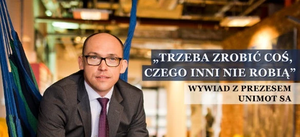 Businessperson wearing a necktie in front of a poster advertising a magazine publication. Graphic design with the text "You have to do something others don't" in Polish. Interview with the president of UNIMOT SA featured in Equity magazine.
