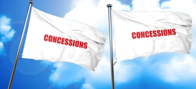 Alt-text: A variety of concession stands with signs advertising various food and drinks. Get your CONCESSIONS here!