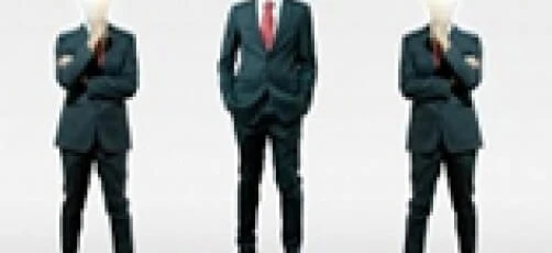A white-collar worker in suit trousers working on graphic design for advertising. Akcenty 2012 highlighted in the background. Businessperson creating graphics for a project.
